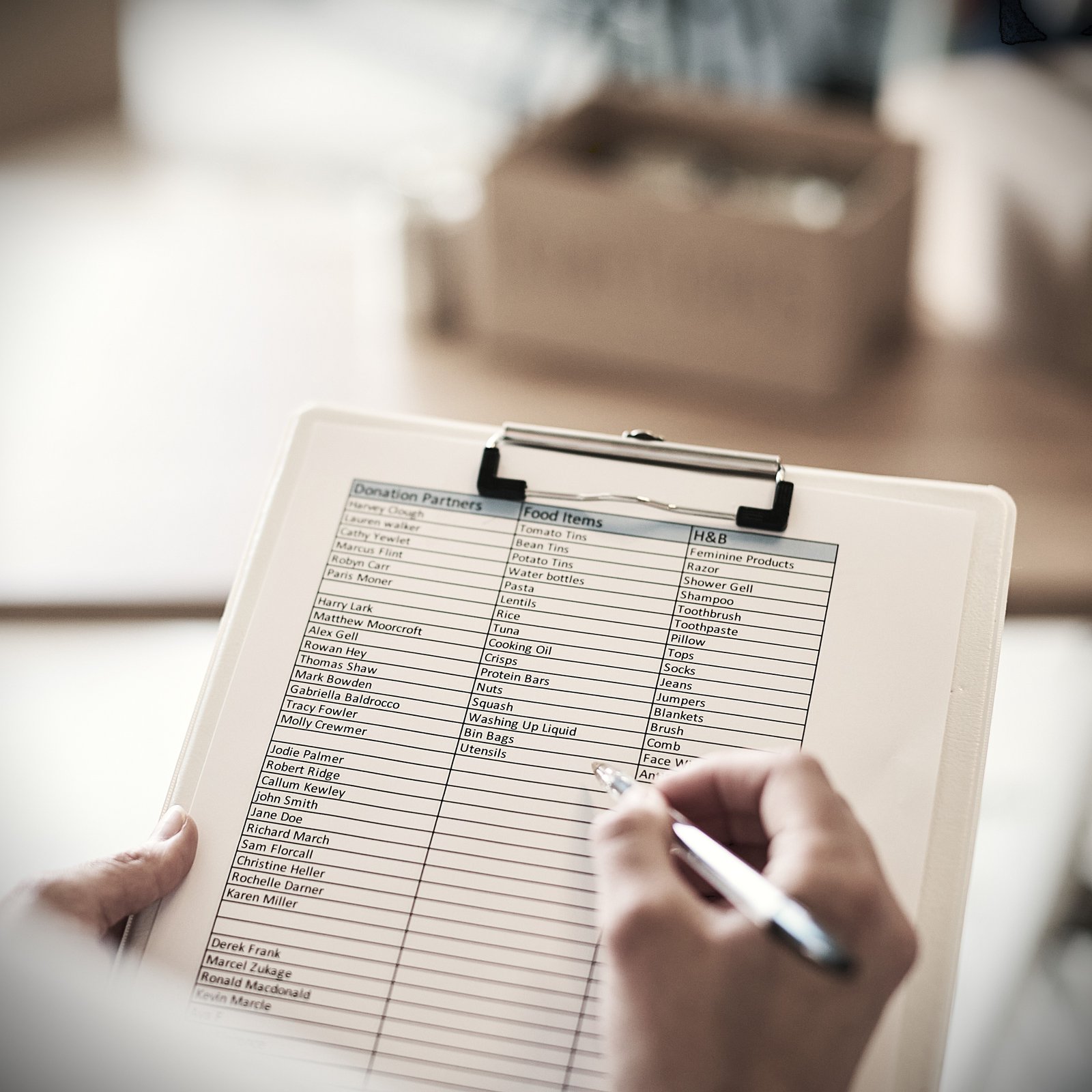 close-up-of-female-charity-worker-with-clipboard-c-2024-10-19-15-18-25-utc